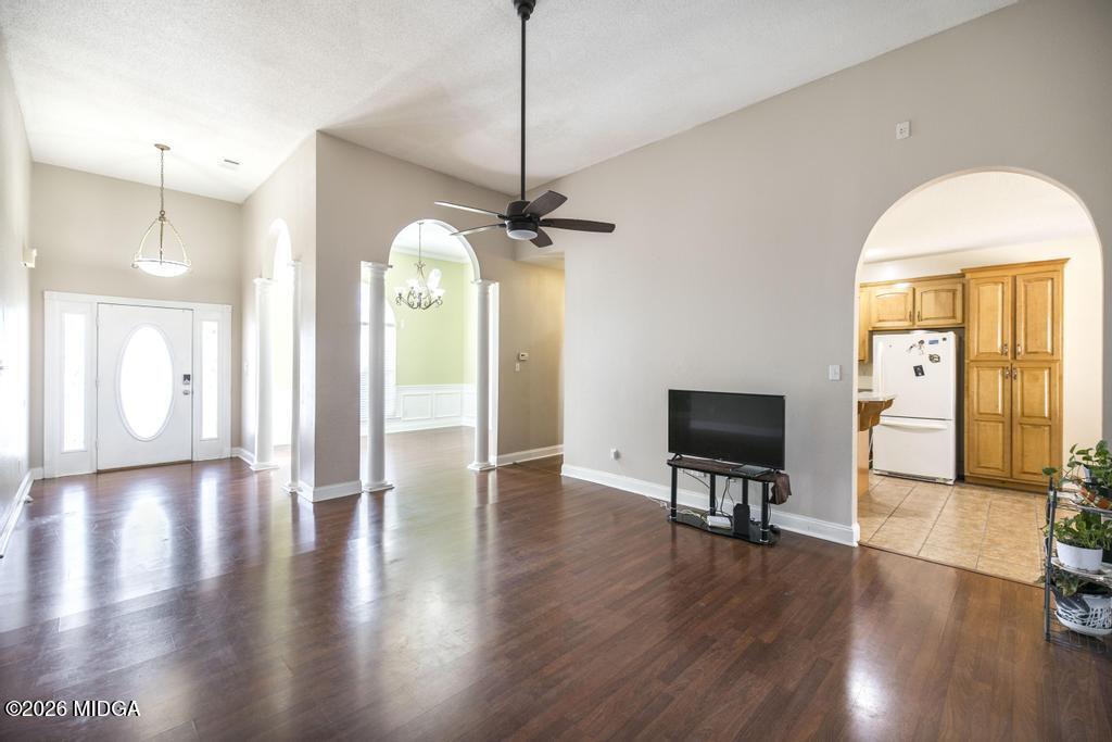 80 Mallard Pointe Kathleen, GA 31047 - Photo 10 of 34 a view of a hallway with wooden floor and a living room