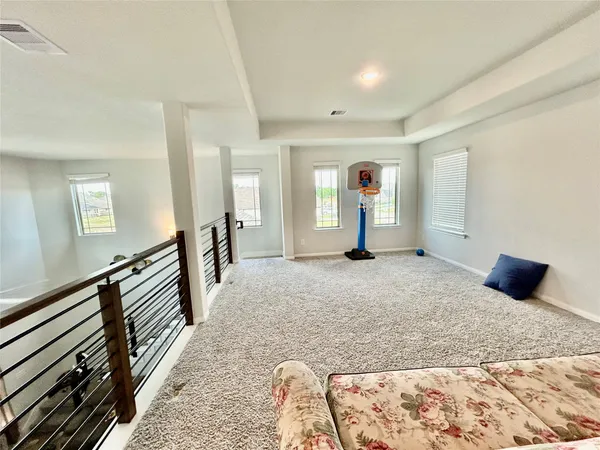 a bedroom with a bed and a large mirror