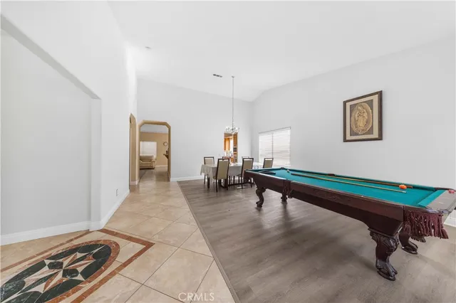 a room with furniture pool table and a table