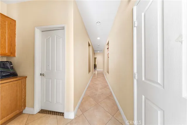 a view of a hallway with a dining area