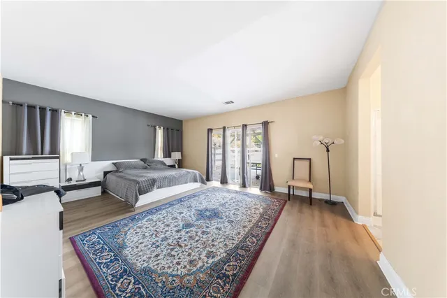 a living room with a couch and a rug