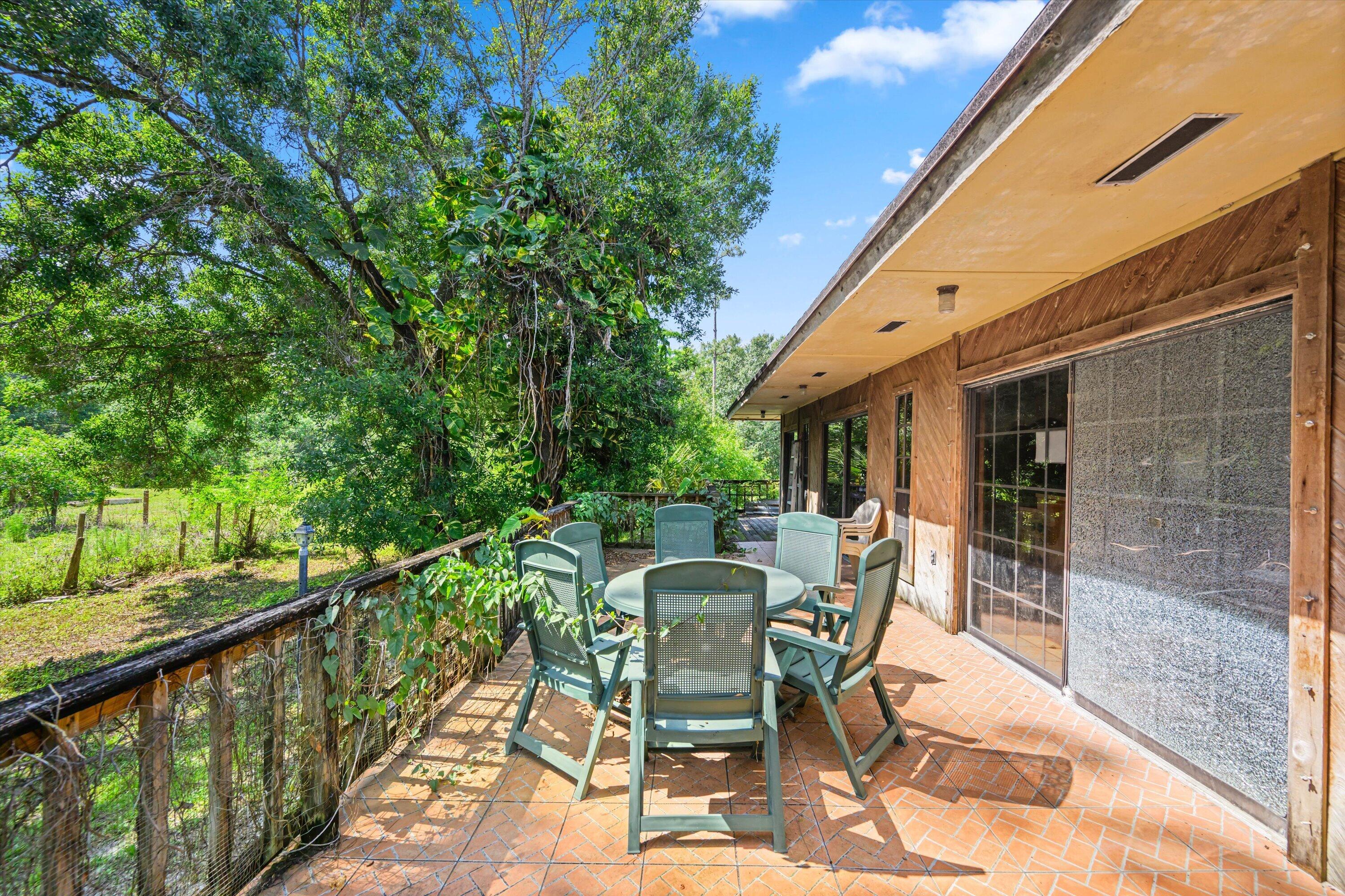 1814 A Road Loxahatchee Groves, FL 33470 - Photo 21 of 38 wrap around porch