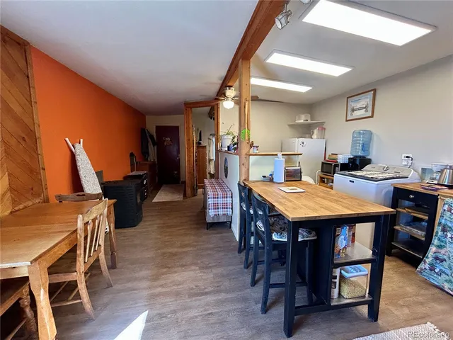 a bathroom with a sink mirror vanity and toilet