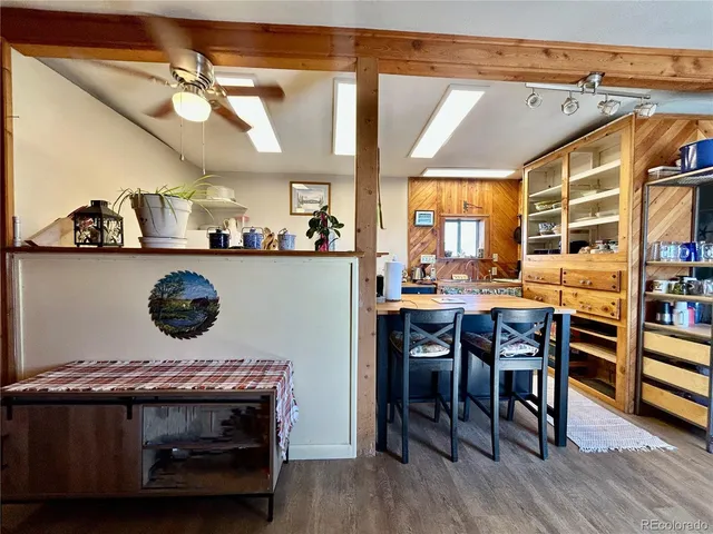 a kitchen with a table and chairs in it