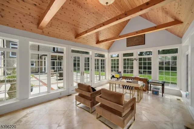 a spacious bedroom with a large bed and a fireplace