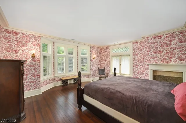an empty room with a ceiling fan and a fan