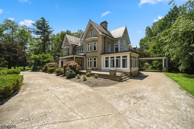 a view of entryway livingroom and hall with wooden floor