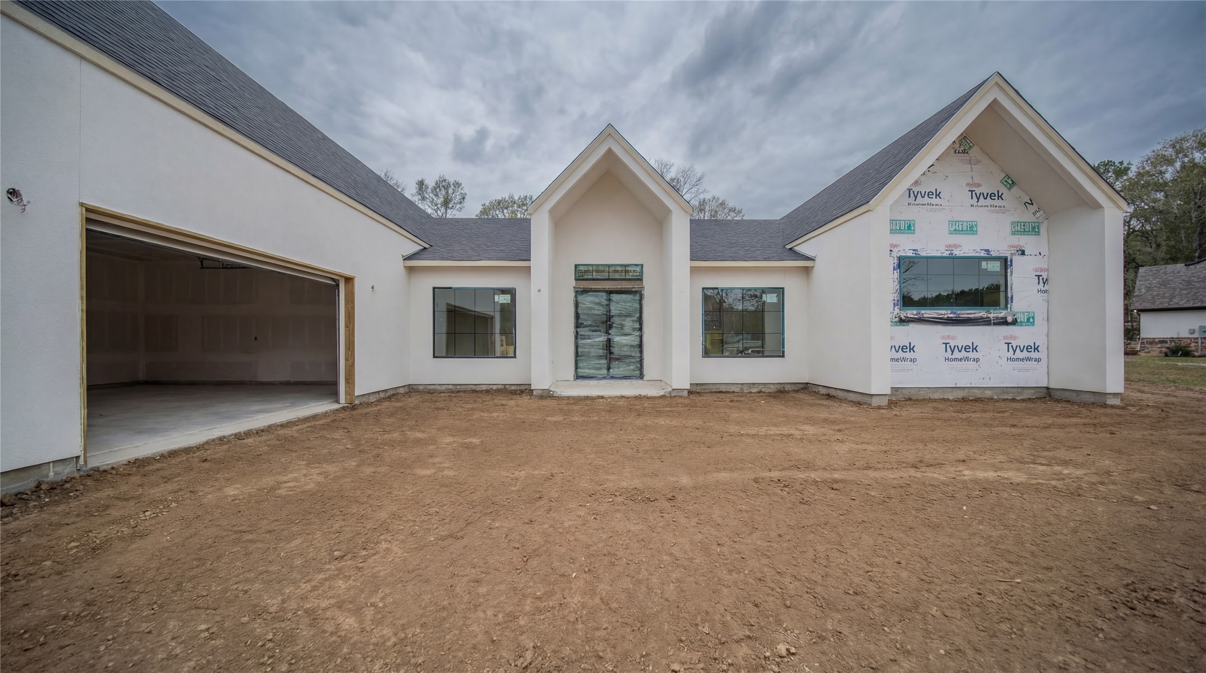 a view of a house with a outdoor space and garage