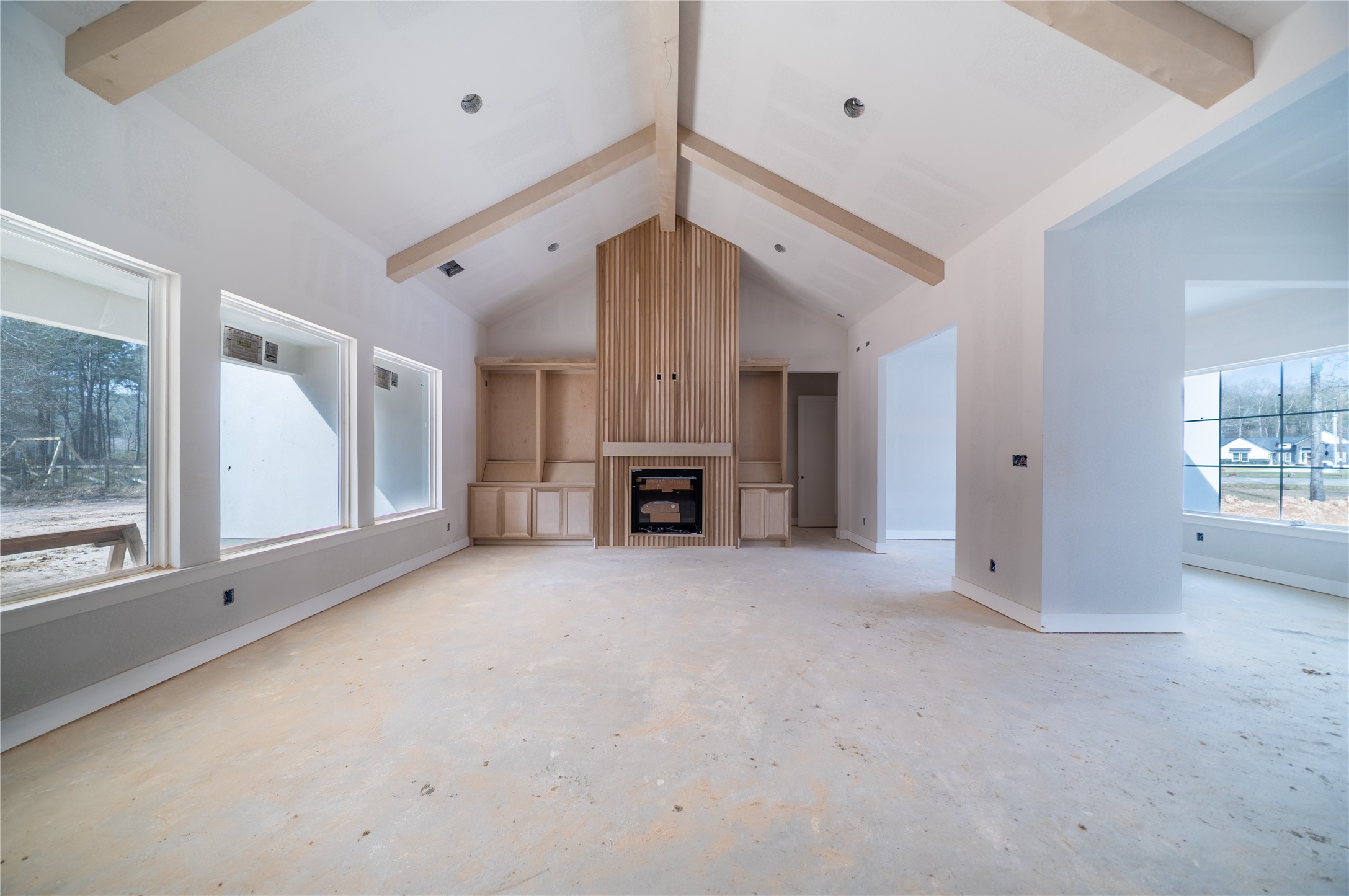 17018 North Saba Court Splendora, TX 77372 - Photo 3 of 5 a view of an empty room with a fireplace and a window