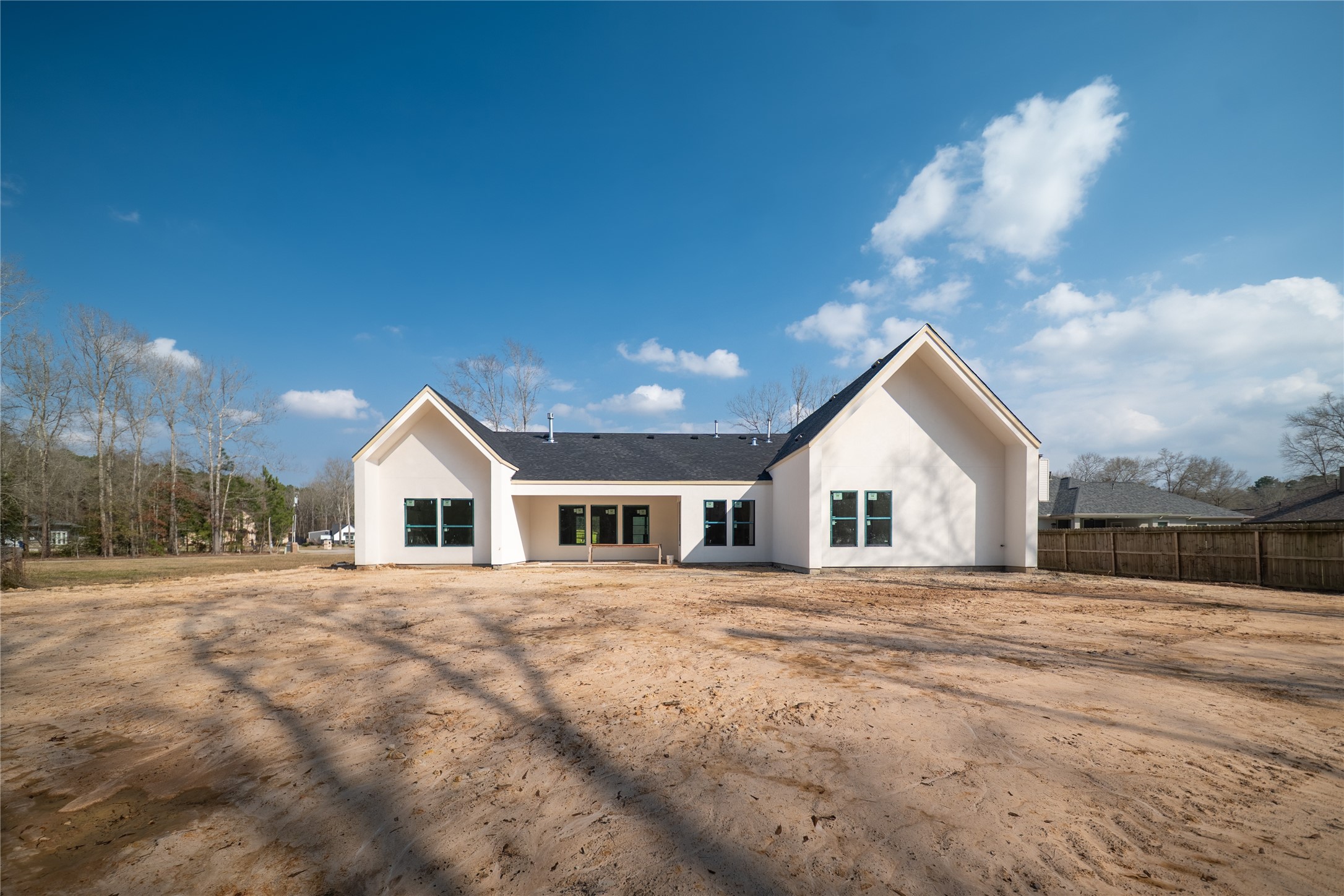 17018 North Saba Court Splendora, TX 77372 - Photo 5 of 5 a view of a house with a yard and trees