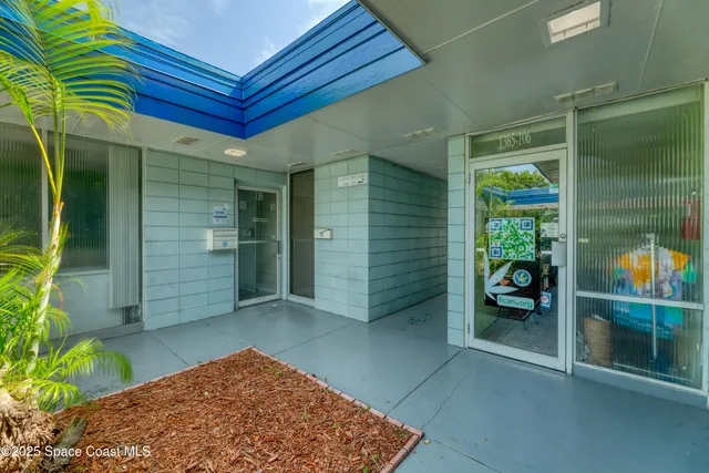 a view of a house with outdoor space and sitting area