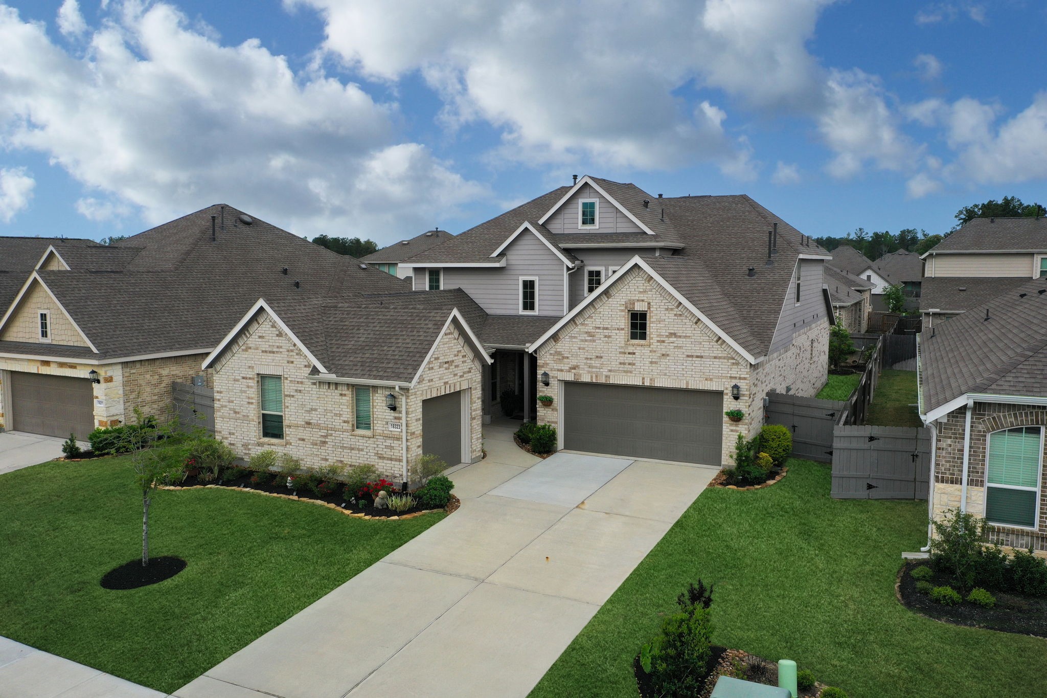 18323 Tiger Flowers Drive Conroe, TX 77302 - Photo 1 of 49 Discover this rare gem: a stunning multi-generational home perfect for family living!