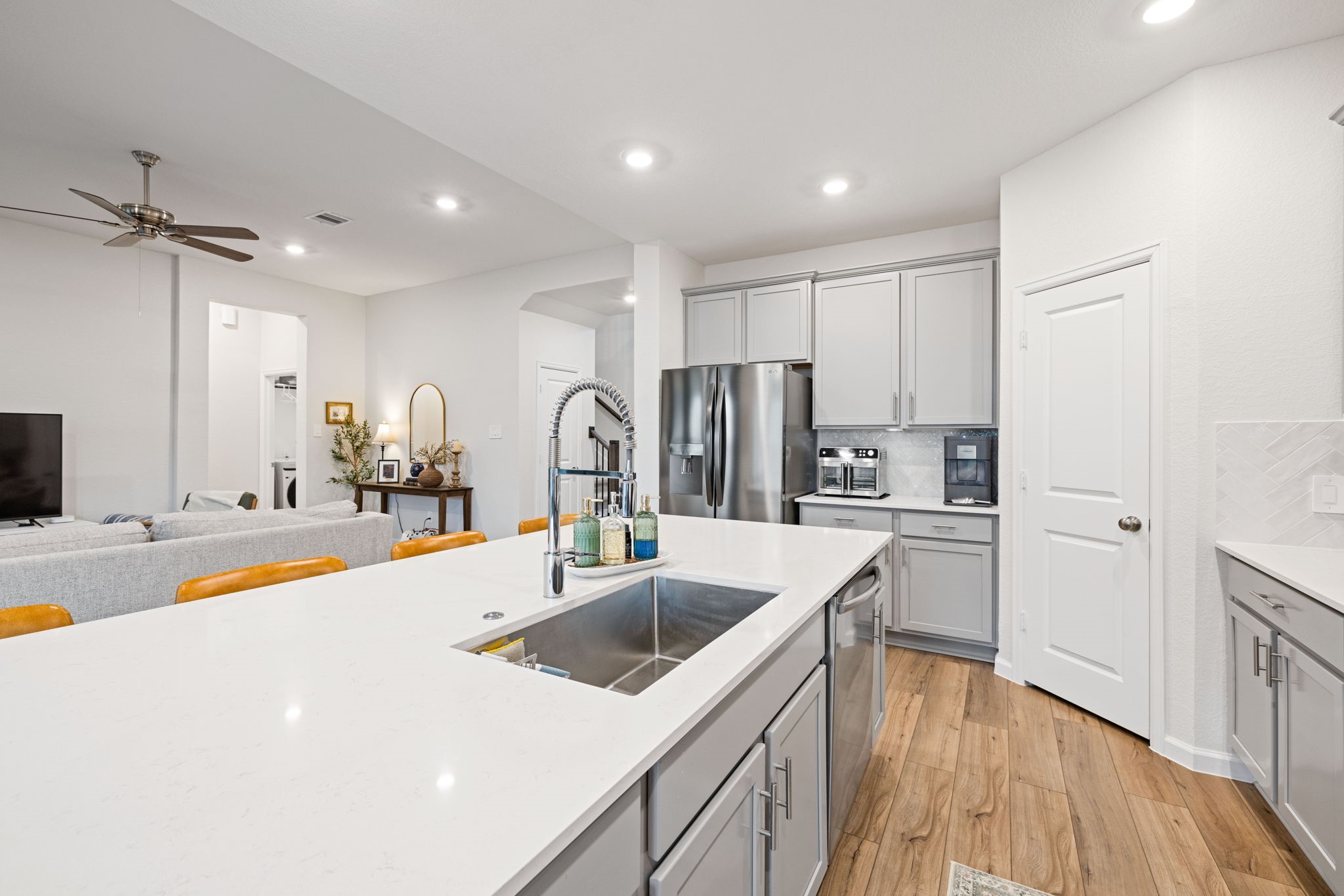 18323 Tiger Flowers Drive Conroe, TX 77302 - Photo 13 of 49 Stunning countertops elevate this modern kitchen.