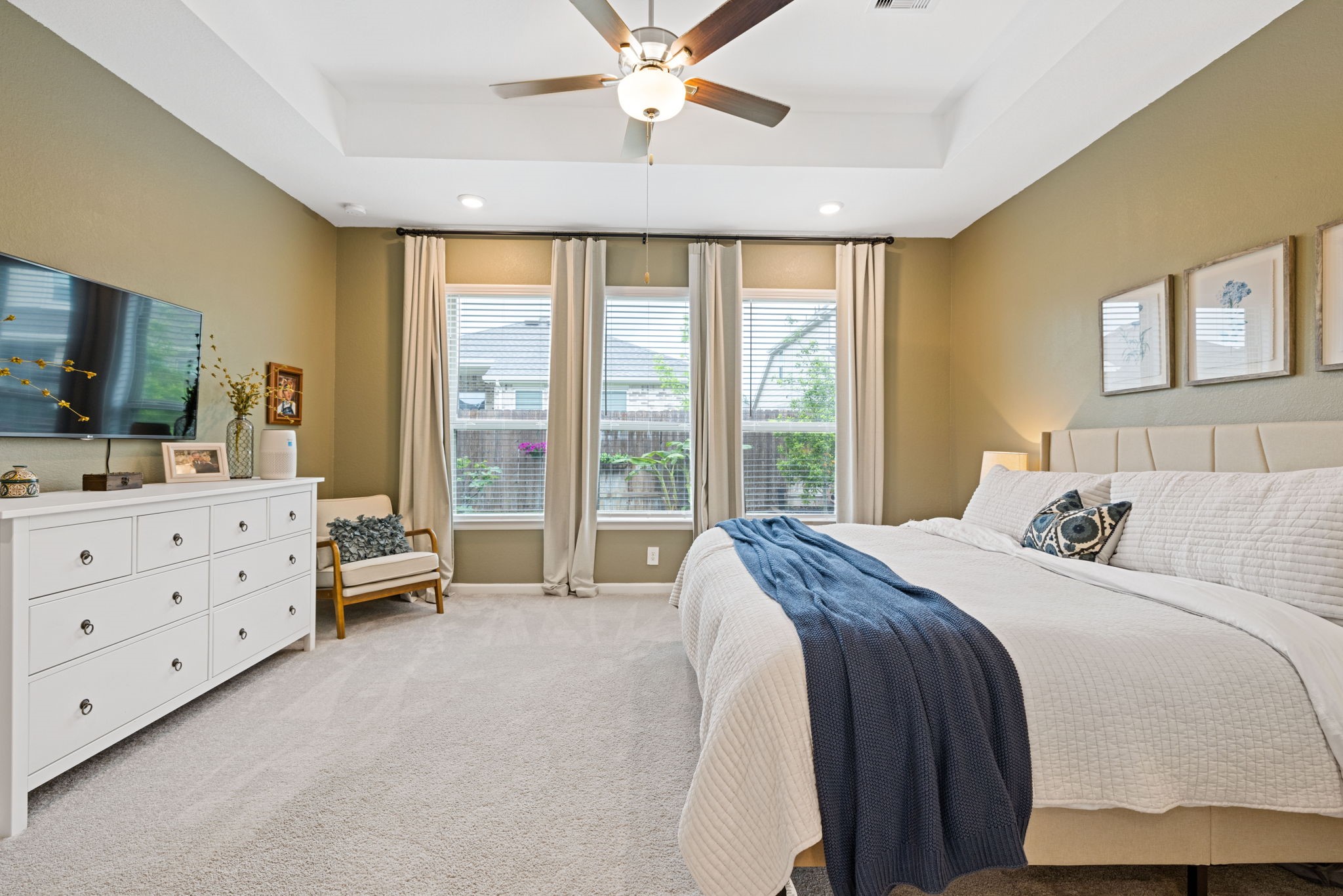 18323 Tiger Flowers Drive Conroe, TX 77302 - Photo 19 of 49 Inviting and spacious primary bedroom for ultimate relaxation.