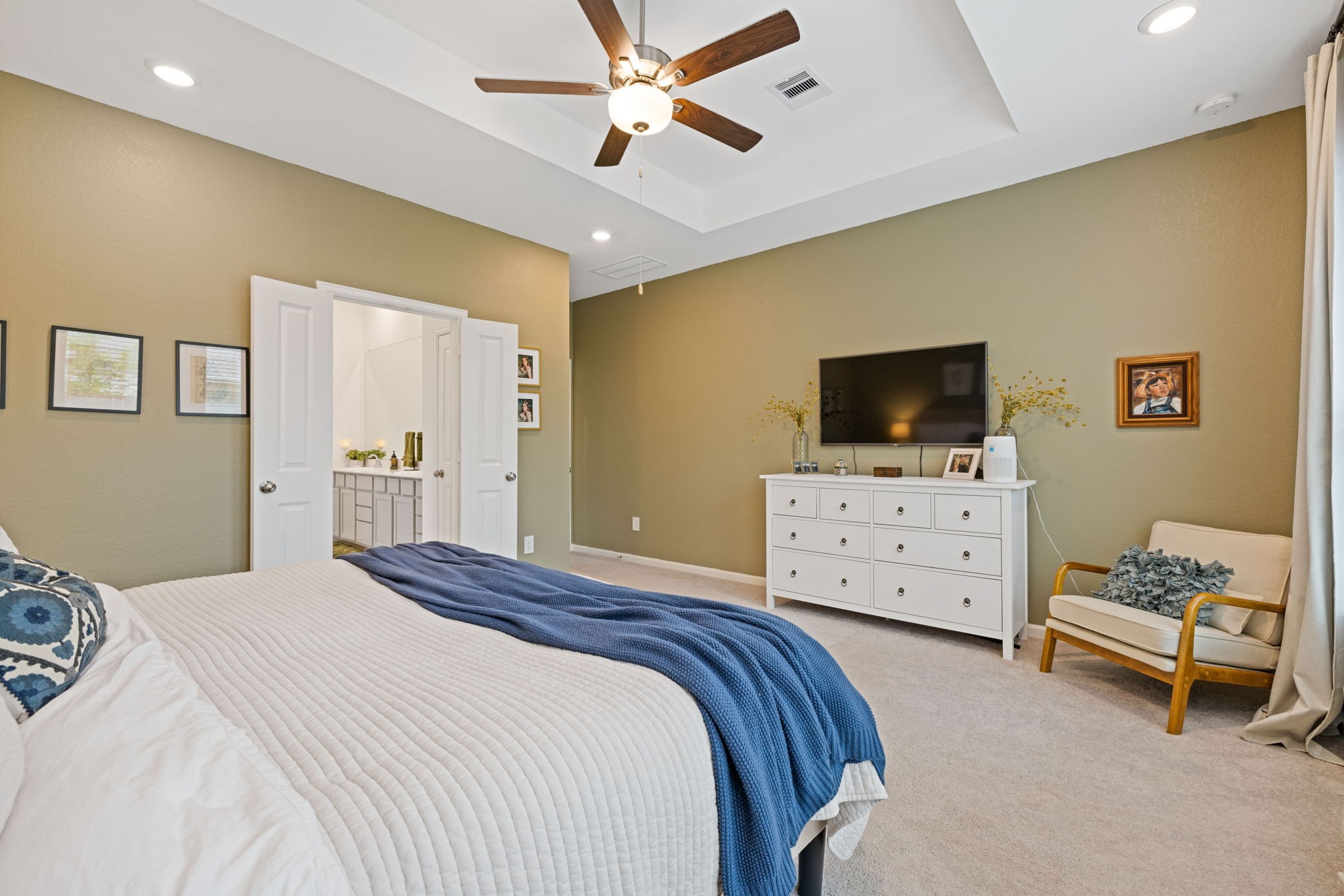 18323 Tiger Flowers Drive Conroe, TX 77302 - Photo 20 of 49 Expansive primary bedroom for ultimate comfort and relaxation.