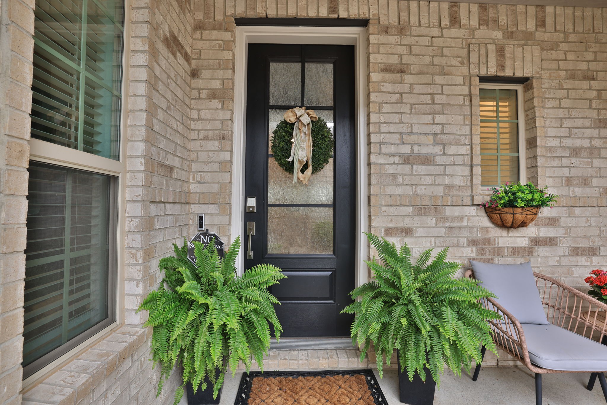 18323 Tiger Flowers Drive Conroe, TX 77302 - Photo 3 of 49 Welcoming entrance with charming decor and lush greenery.