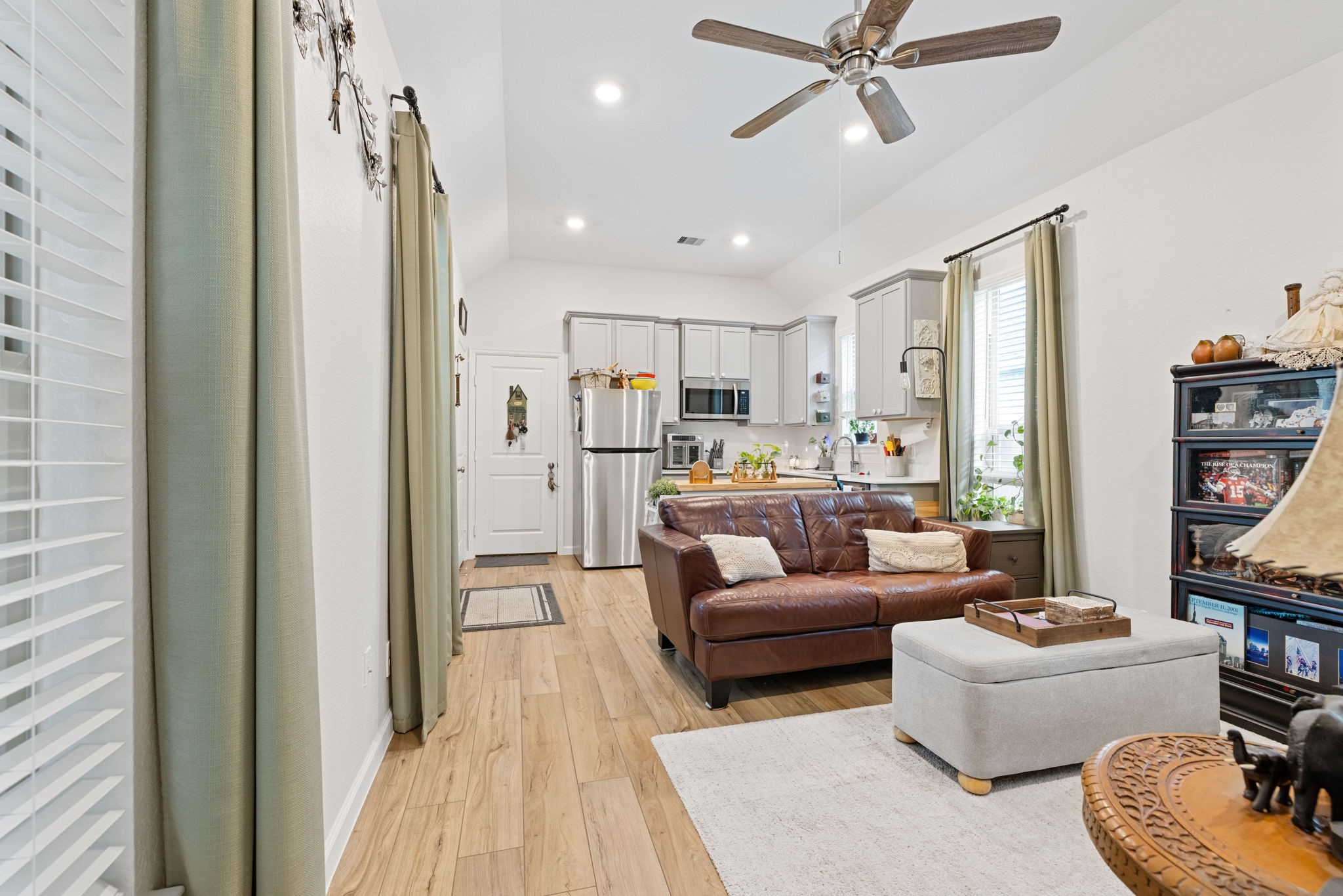 18323 Tiger Flowers Drive Conroe, TX 77302 - Photo 36 of 49 Experience the airy elegance of an open-concept kitchen and living area, perfect for modern living with the convenience and safety of being in the attached apartment