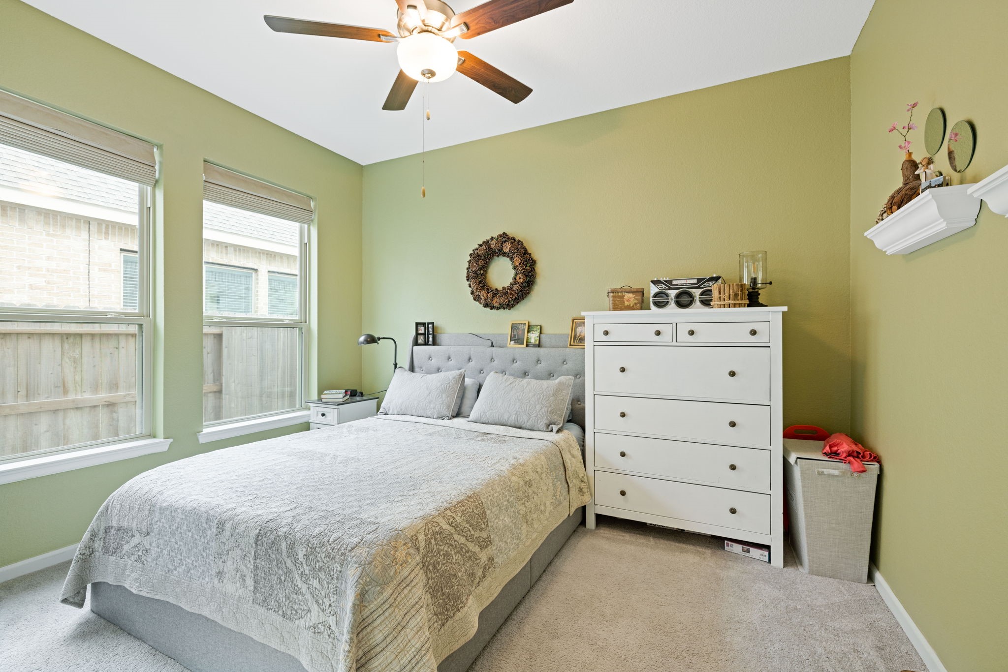 18323 Tiger Flowers Drive Conroe, TX 77302 - Photo 37 of 49 Spacious apartment bedroom with abundant natural light and modern features.