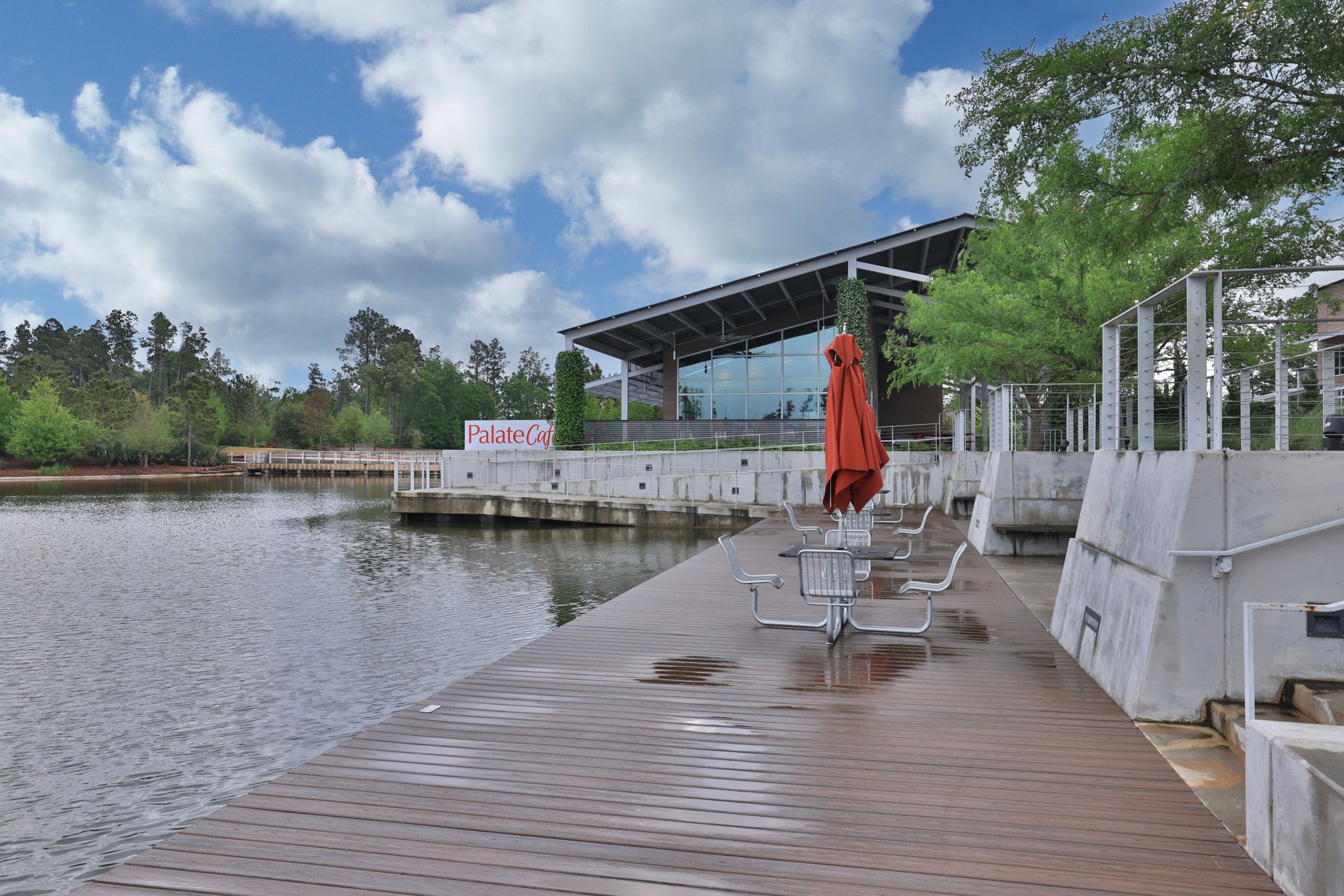 18323 Tiger Flowers Drive Conroe, TX 77302 - Photo 48 of 49 Experience tranquility by the serene neighborhood lake, with a nearby park, play area, and splash pad. More amenities coming soon!