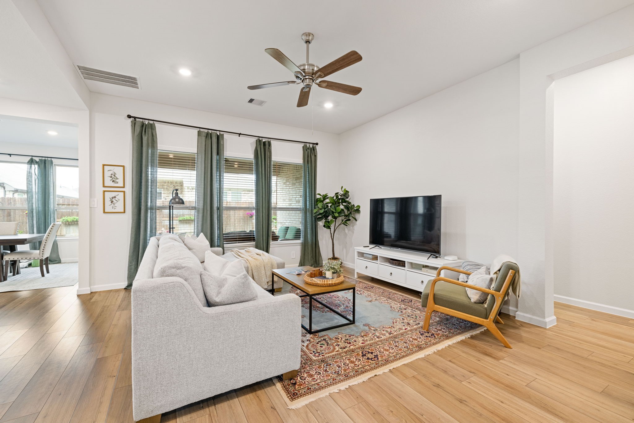 18323 Tiger Flowers Drive Conroe, TX 77302 - Photo 7 of 49 Bright and inviting family room with an open, airy ambiance.