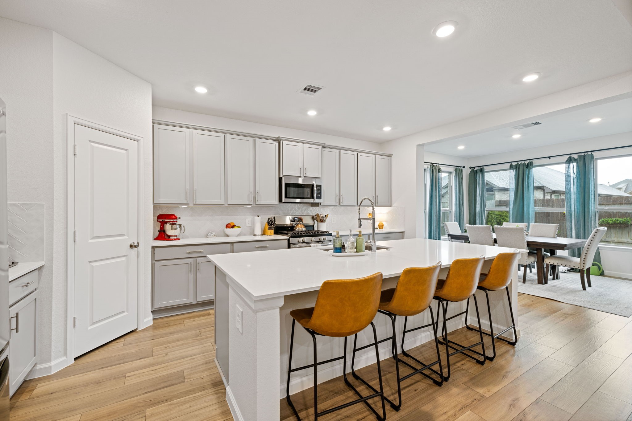 18323 Tiger Flowers Drive Conroe, TX 77302 - Photo 10 of 49 Inviting breakfast bar perfect for casual dining and entertaining.