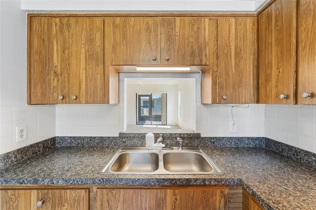 a kitchen with a sink and cabinets