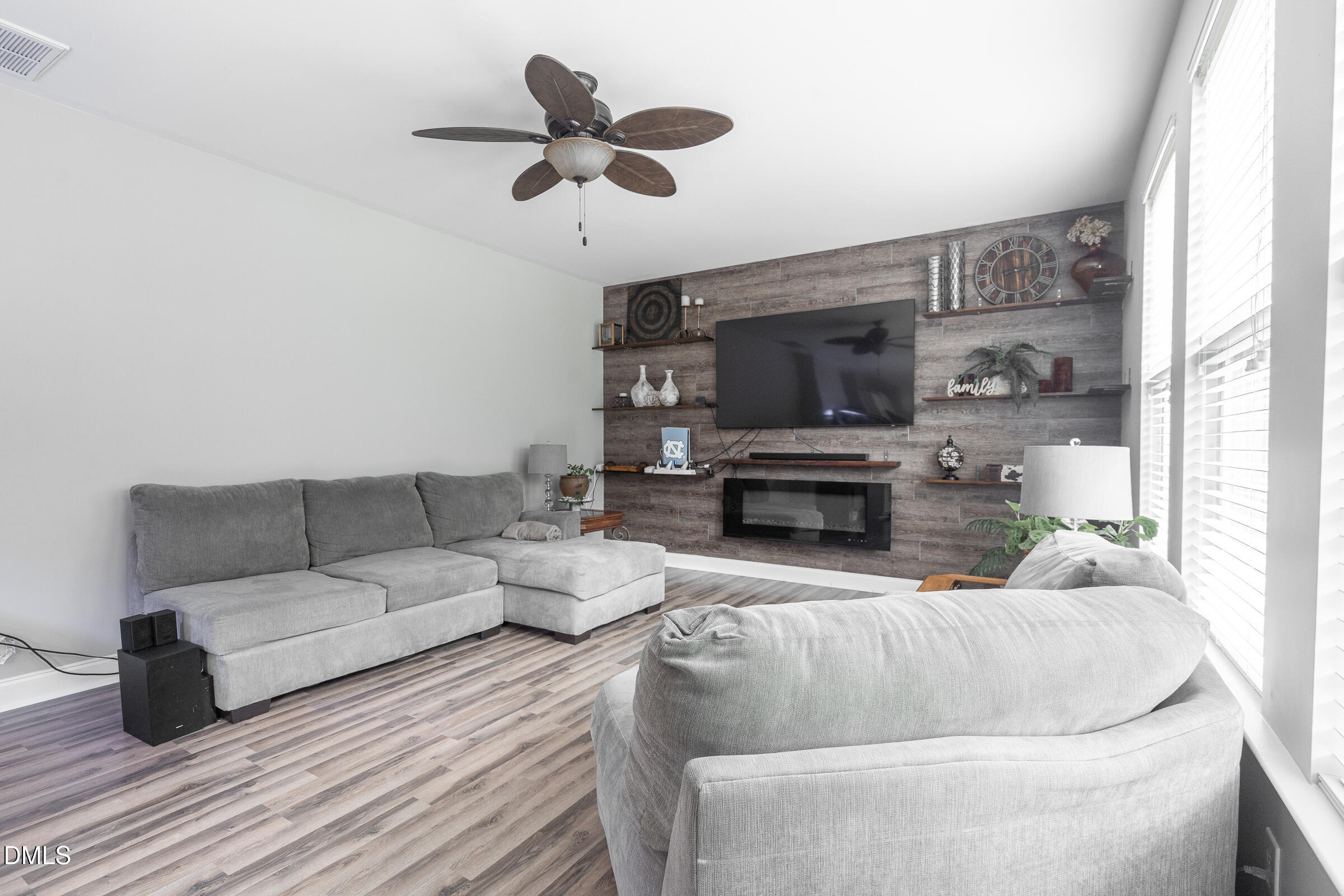 2756 Shepherd Valley Street Raleigh, NC 27610 - Photo 11 of 30 a living room with furniture and a fireplace