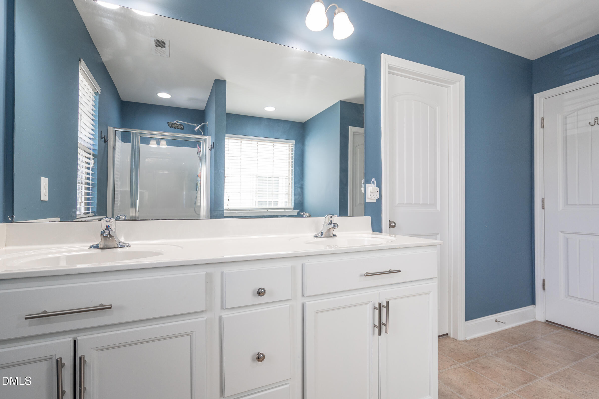2756 Shepherd Valley Street Raleigh, NC 27610 - Photo 17 of 30 a bathroom with a sink and a mirror