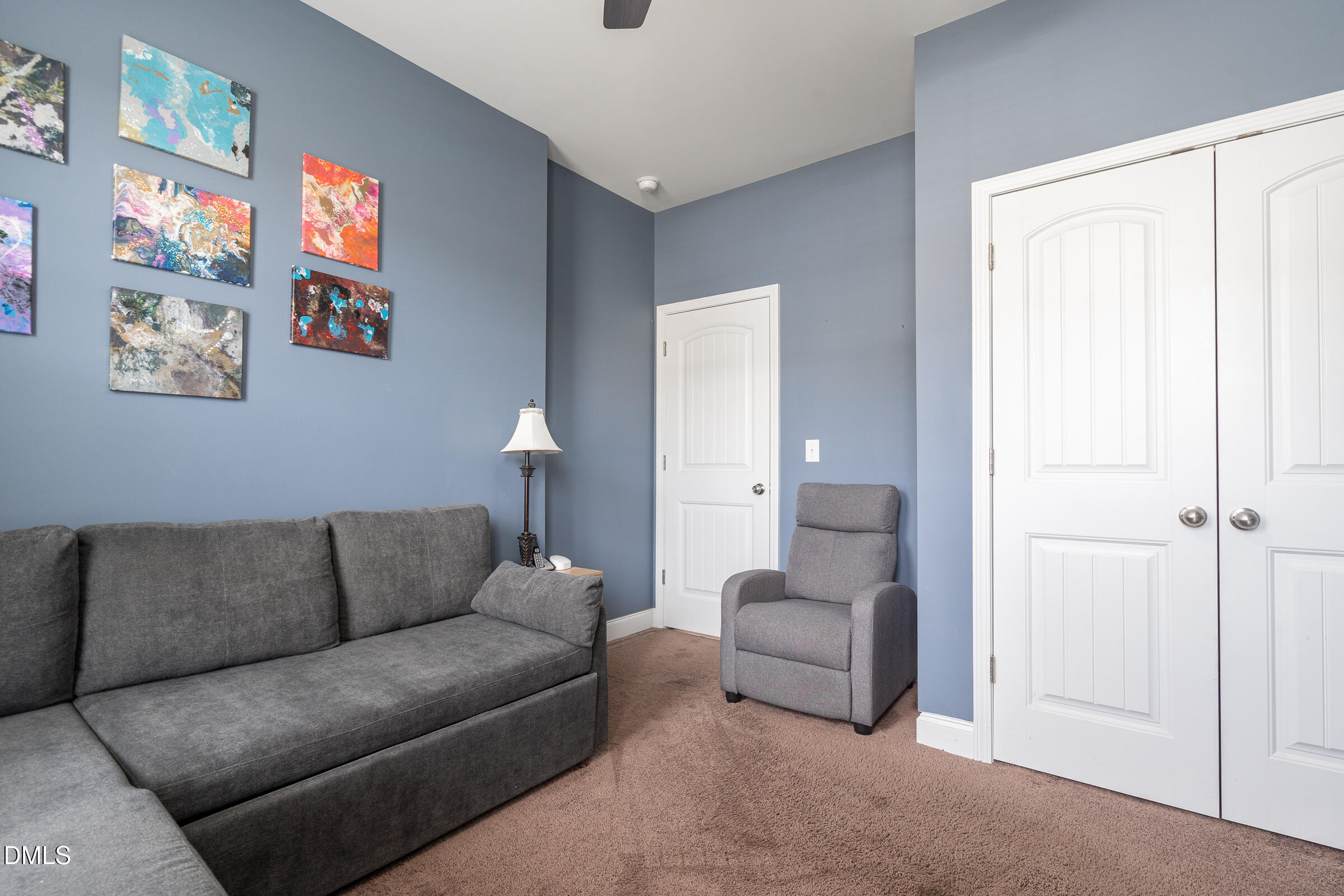 2756 Shepherd Valley Street Raleigh, NC 27610 - Photo 2 of 30 a living room with furniture and a large window