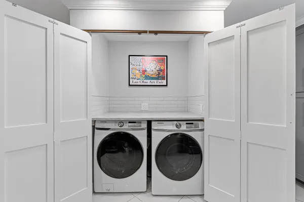 a utility room with dryer and washer