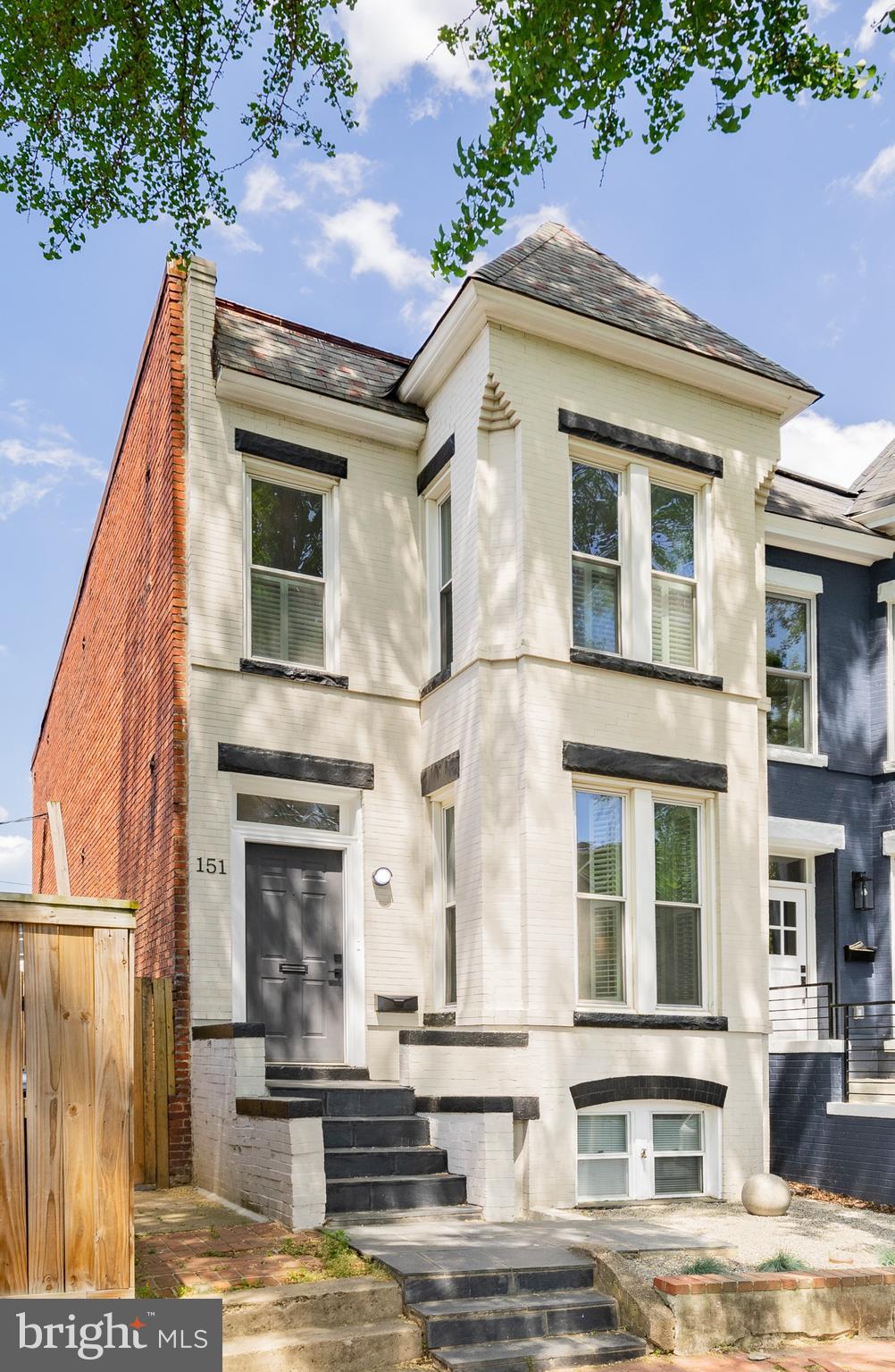 a front view of a building with street view