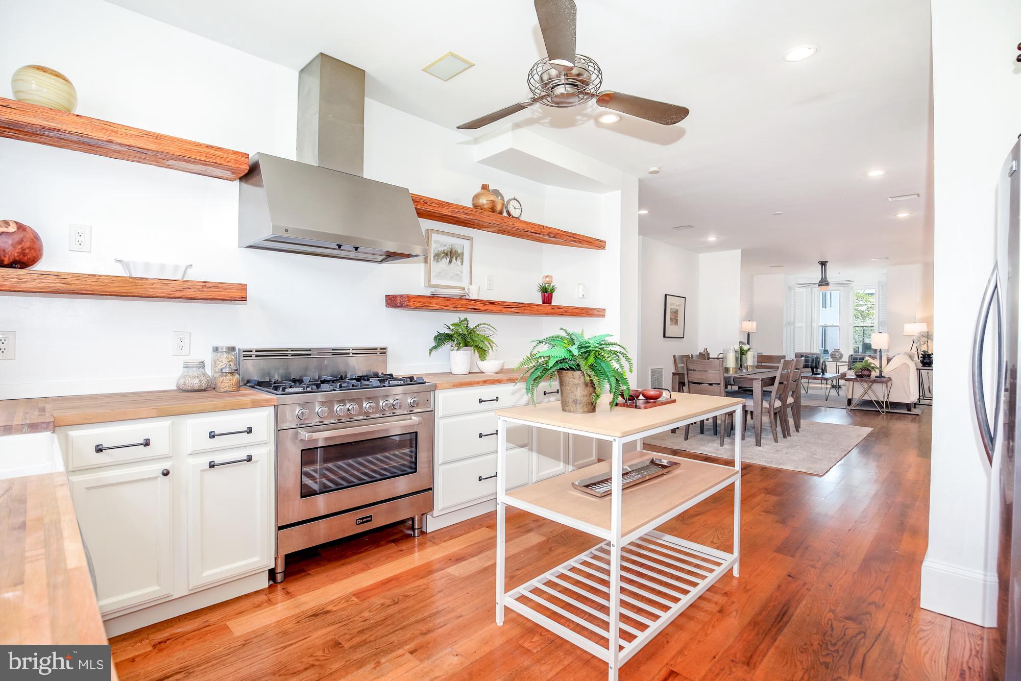 151 Thomas Street Northwest Washington, DC 20001 - Photo 11 of 40 a view of kitchen with cabinets and wooden floor