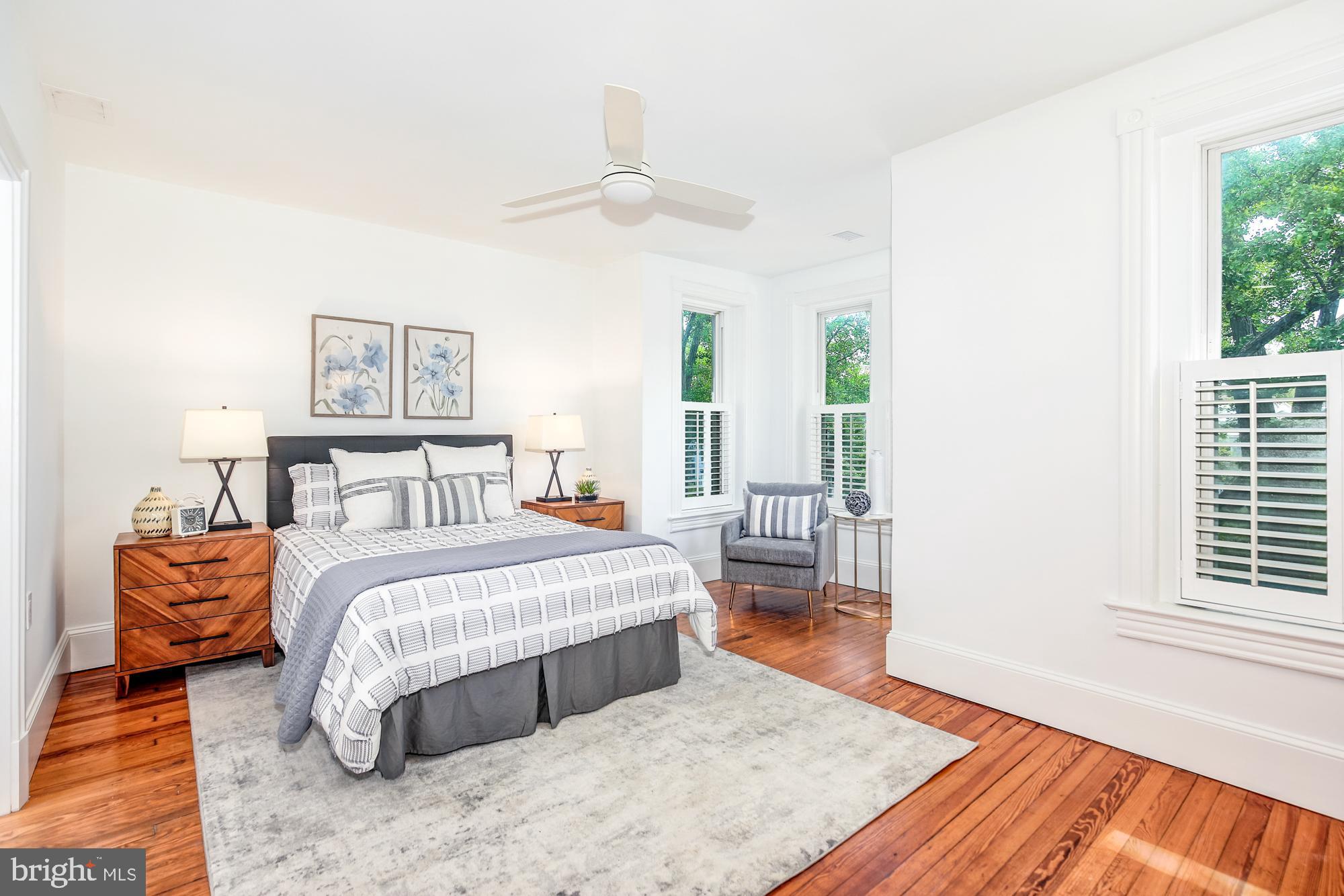 151 Thomas Street Northwest Washington, DC 20001 - Photo 14 of 40 a spacious bedroom with a bed and a large window