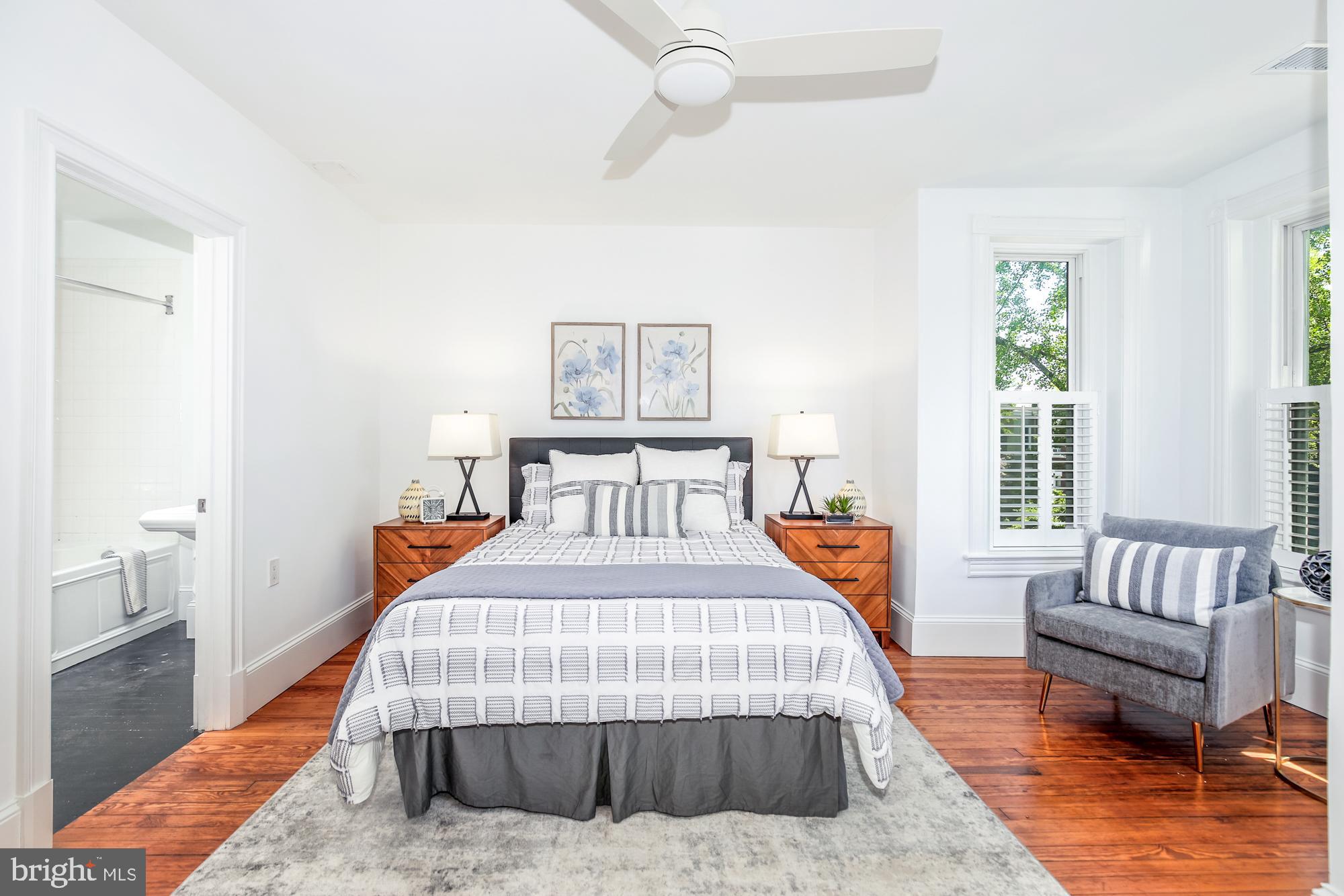 151 Thomas Street Northwest Washington, DC 20001 - Photo 15 of 40 a bedroom with a bed and a couch