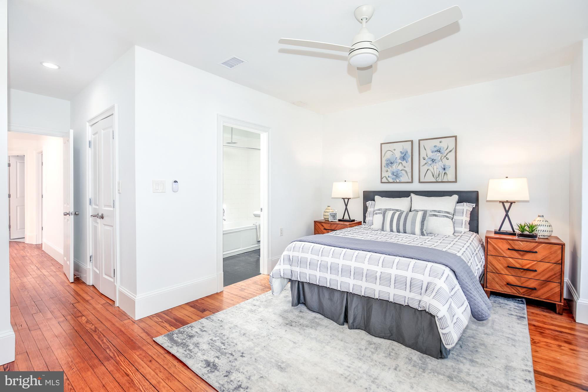 151 Thomas Street Northwest Washington, DC 20001 - Photo 16 of 40 a bedroom with a bed and wooden floor