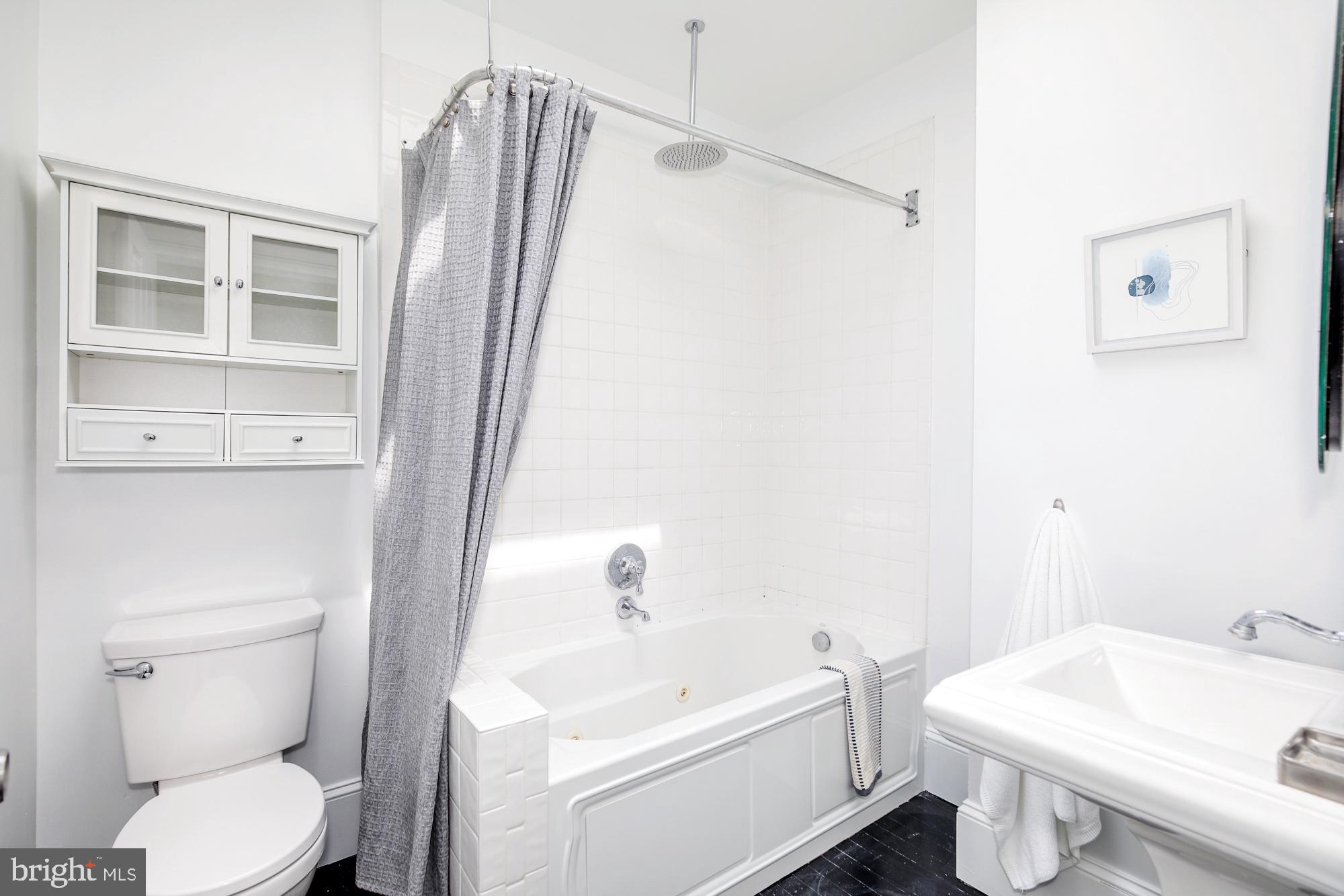 151 Thomas Street Northwest Washington, DC 20001 - Photo 17 of 40 a white toilet sitting next to a bathroom sink