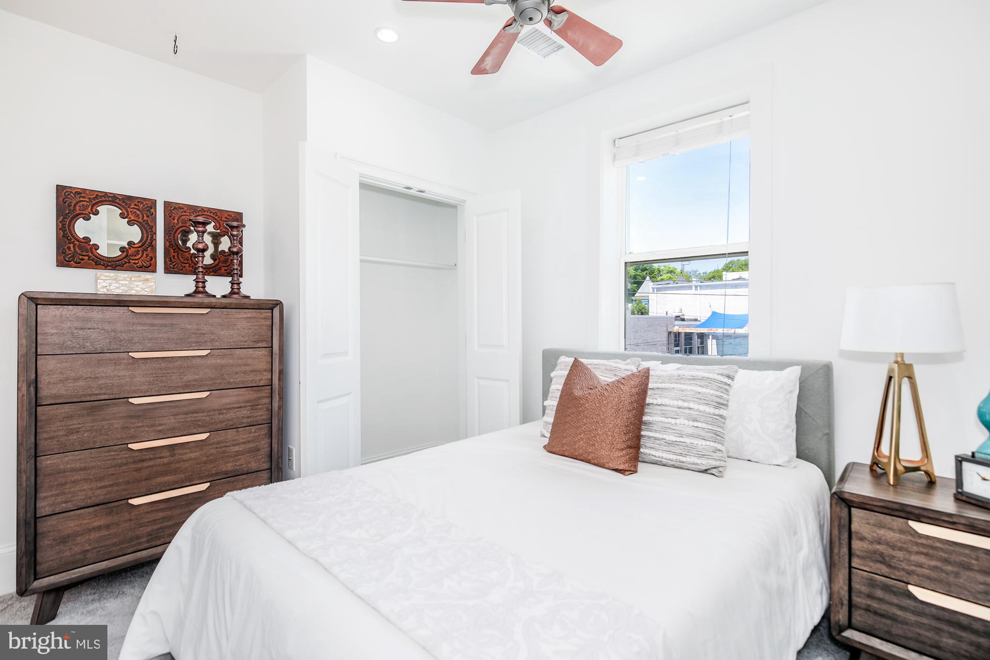 151 Thomas Street Northwest Washington, DC 20001 - Photo 19 of 40 a bedroom with a bed and a window
