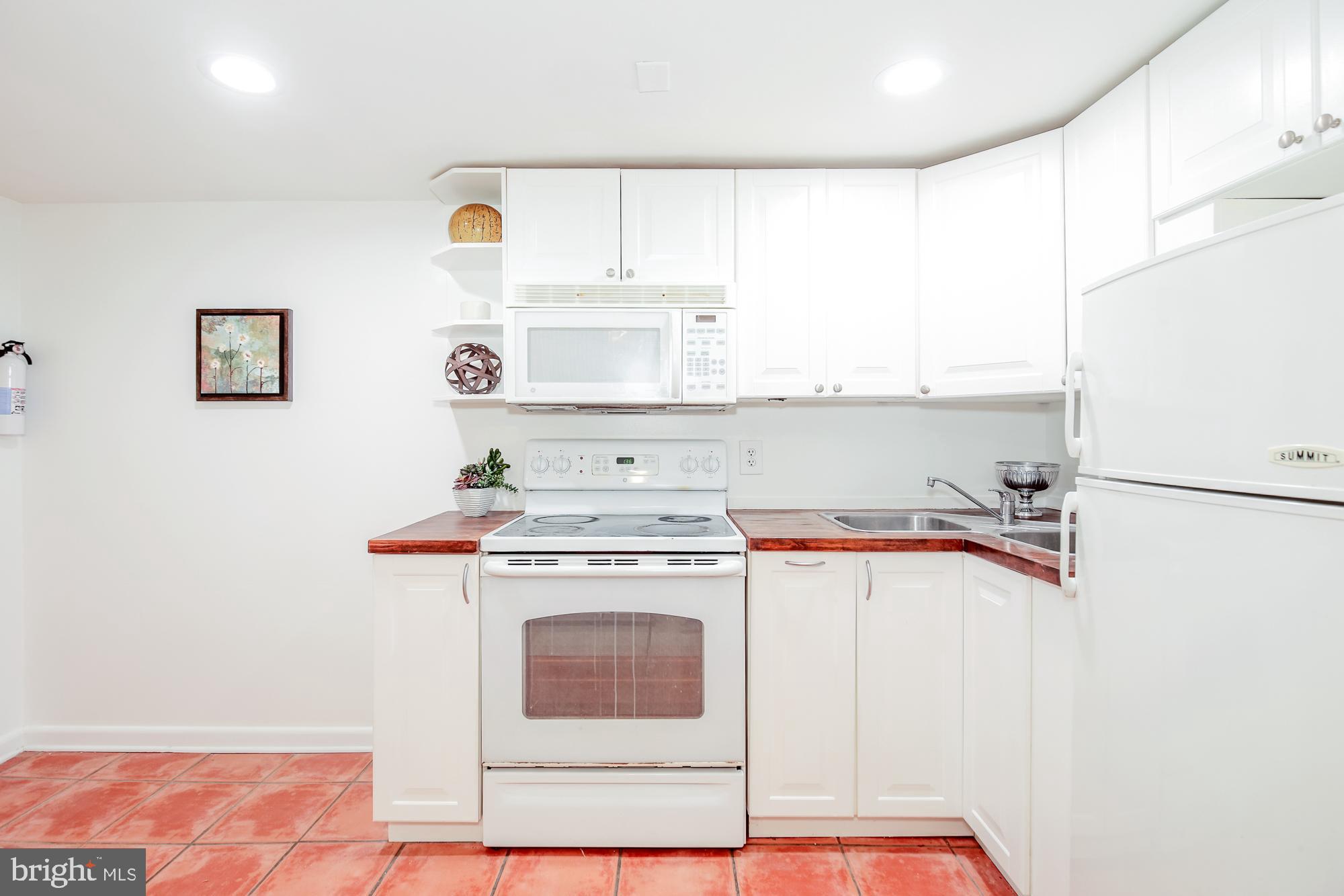 151 Thomas Street Northwest Washington, DC 20001 - Photo 28 of 40 a utility room with sink dryer and washer