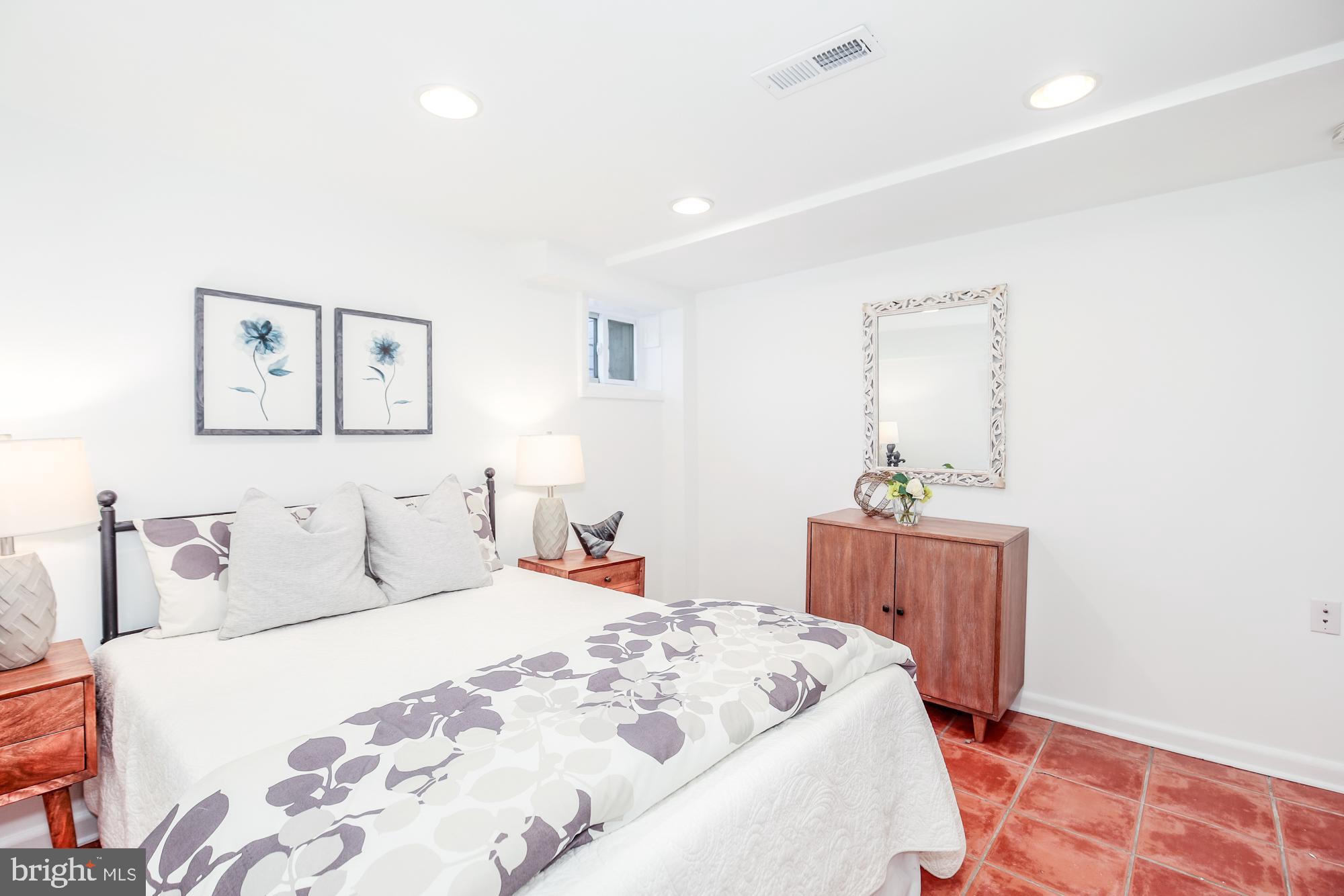 151 Thomas Street Northwest Washington, DC 20001 - Photo 30 of 40 a bedroom with a bed and a table