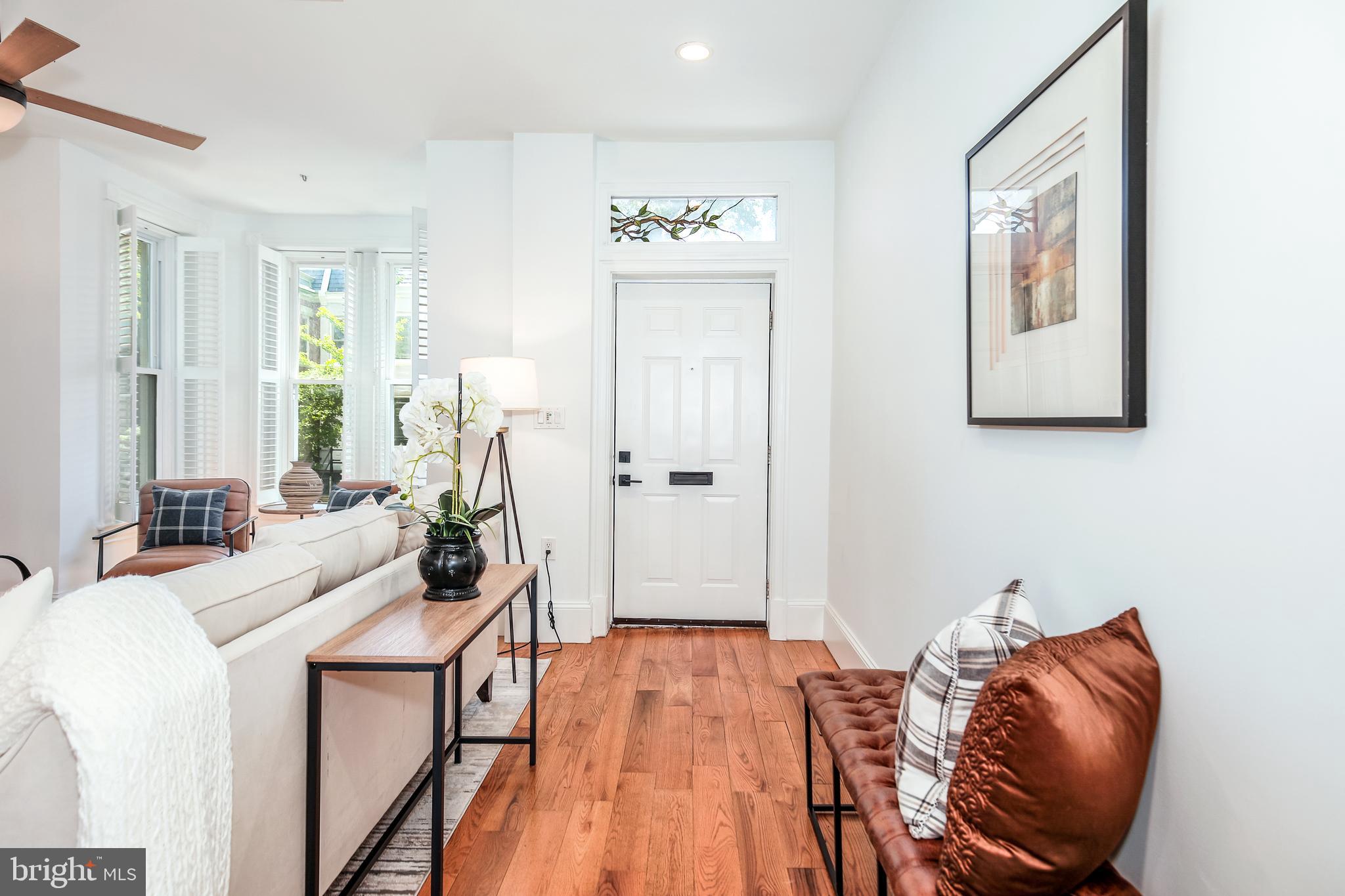 151 Thomas Street Northwest Washington, DC 20001 - Photo 3 of 40 a room with furniture and wooden floor