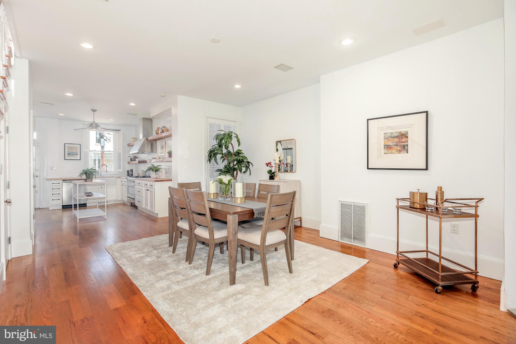151 Thomas Street Northwest Washington, DC 20001 - Photo 8 of 40 a dining room with wooden floor and a table