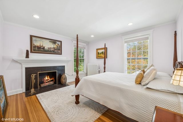 a bedroom with a bed and a fireplace