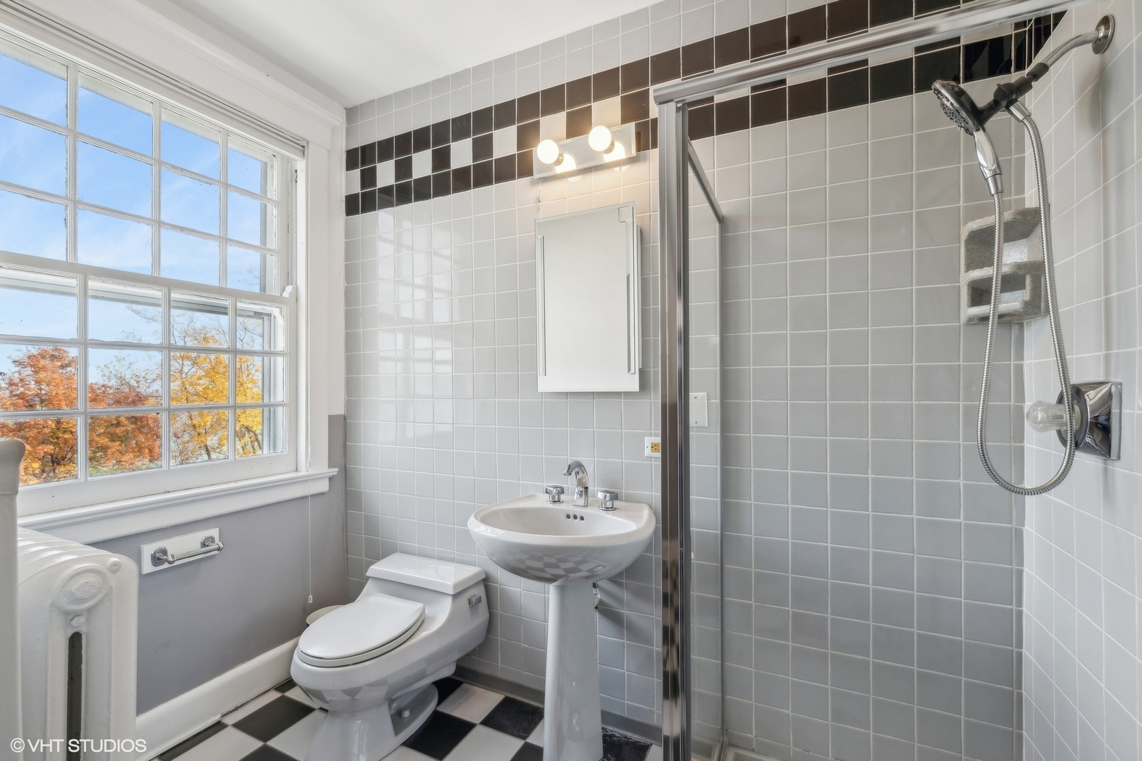 111 North Mayflower Road Lake Forest, IL 60045 - Photo 22 of 28 a bathroom with a sink toilet and shower