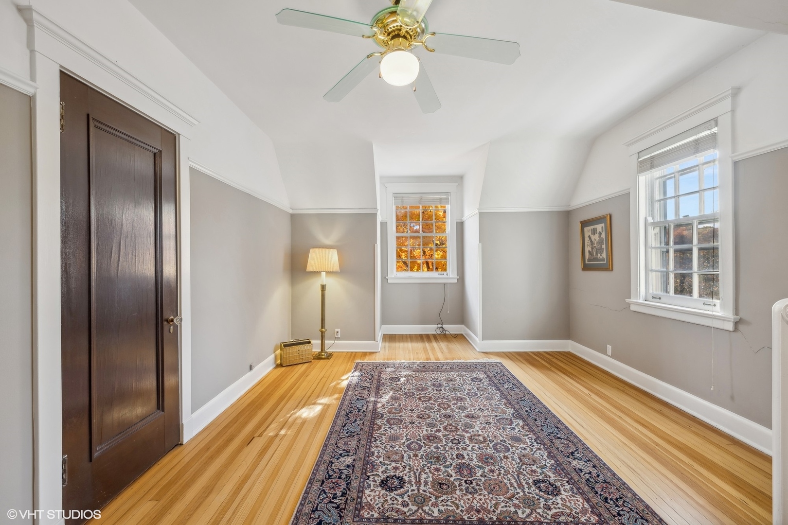 111 North Mayflower Road Lake Forest, IL 60045 - Photo 24 of 28 a view of a bedroom with wooden floor and a chandelier fan