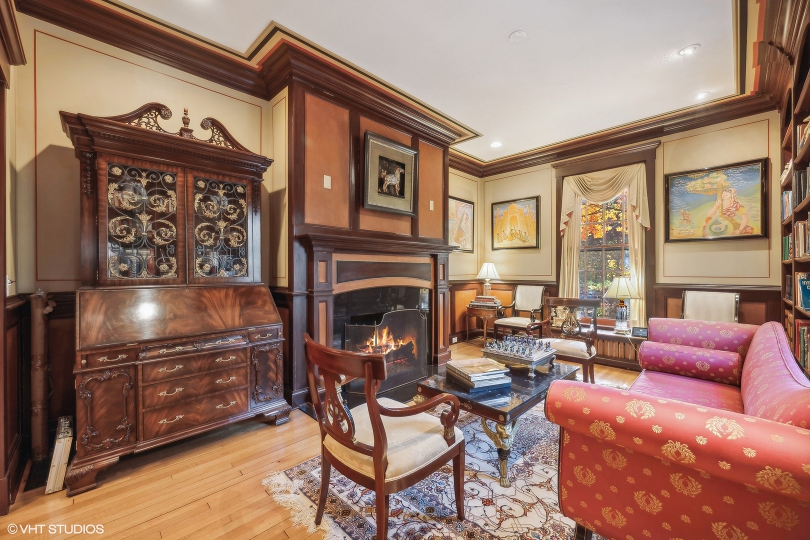 111 North Mayflower Road Lake Forest, IL 60045 - Photo 9 of 28 a living room with furniture a large window and a fireplace