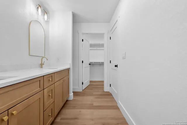 a view of hallway with wooden floor