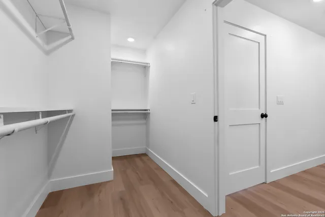 a view of an empty walk in closet
