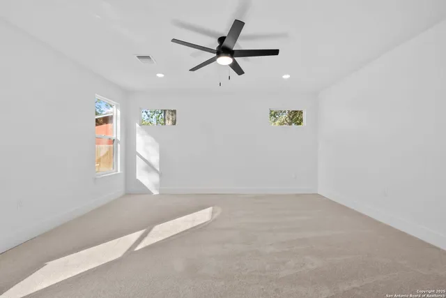 a white toilet and shower in a bathroom