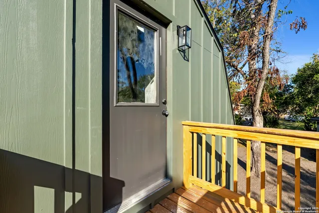 a view of balcony with a tree