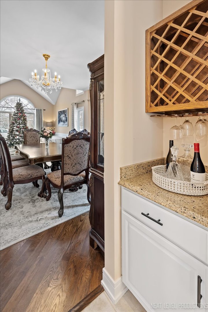 970 Waterside Court Aurora, IL 60502 - Photo 11 of 42 a living room with furniture and a chandelier